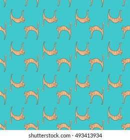 Seamless pattern with doodle cute cats on blue background. Vector illustration for design