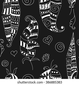 Seamless pattern with doodle feathers