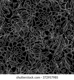 Seamless pattern with doodle flowers. Vintage decorative elements. Hand drawn background. Perfect for printing on fabric or paper. Outline drawing, black and white.