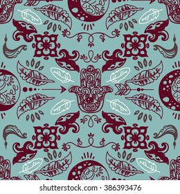 Seamless pattern with doodle moons and hamsa symbols, tribal magical ornament, vector illustration