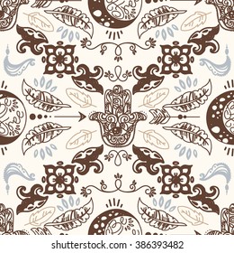 Seamless pattern with doodle moons and hamsa symbols, tribal magical ornament, vector illustration