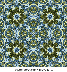 Seamless pattern doodle ornament. Colorful background. Ethnic motives. Zentangl. Green and blue tones