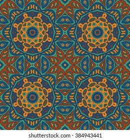 Seamless pattern doodle ornament. Colorful background. Ethnic motives. Zentangl. Orange, green and blue tones