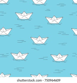 Seamless pattern with doodle paper boats on blue. Vector background.