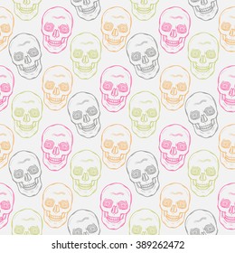 Seamless pattern with  doodle skulls  on a white background