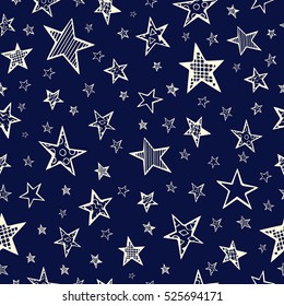 Seamless pattern with doodle stars on a blue background.Hand drawn. Vector illustration.