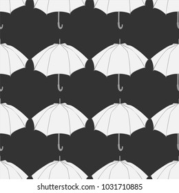 Seamless pattern with doodle umbrellas. For fabric, textile, wallpaper, wrapping paper. Vector Illustration. Hand drawn sketch. White elements on dark gray background.