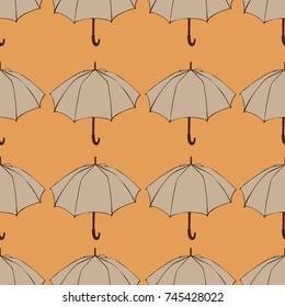 Seamless pattern with doodle umbrellas. For fabric, textile, wallpaper, wrapping paper. Vector Illustration. Autumn hand drawn sketch. Beige elements on orange background.