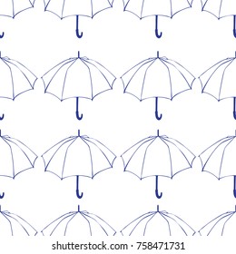 Seamless pattern with doodle umbrellas. For fabric, textile, wallpaper, wrapping paper. Vector Illustration. Hand drawn sketch. Blue line drawing on wite background. 