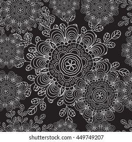 Seamless pattern with doodles elements for design. black and white flowers, leaves