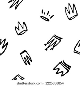 Seamless pattern of doodles hand drawn crowns. Vector illustration