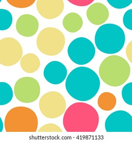 Seamless pattern with dots of fresh colors on a white background. Vector repeating texture.