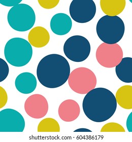 Seamless pattern with dots of fresh colors on a white background. Vector repeating texture.