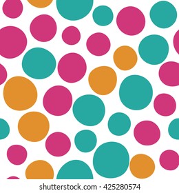 Seamless pattern with dots of spring colors on a white background