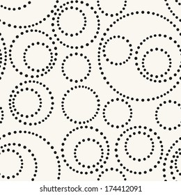 Seamless pattern with dotted circles. Vector repeating texture. Stylish background