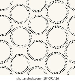Seamless pattern with dotted circles. Vector repeating texture. Stylish background