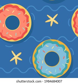 Seamless pattern with doughnut pool floats pink and blue 