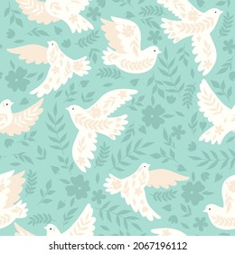 Seamless pattern with doves on a blue background. Vector graphics.