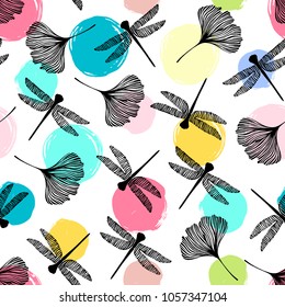 Seamless pattern with dragonflies and ginkgo leaves.