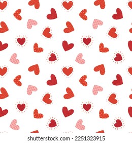 Seamless pattern with drawing se different hearts in red and pink tones on a white background, Valentine's drawing
