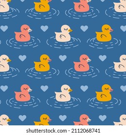 Seamless pattern with ducks. Colored animal repeating background. Hand drawn cute design for fabric. Vector illustration