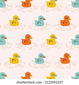 Seamless pattern with ducks. Colored animal repeating background. Hand drawn cute design for fabric. Vector illustration