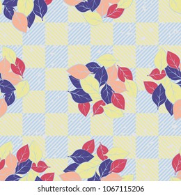 Seamless pattern. Easily editable. Groups of leaves on the background of a checkered pattern with diagonal striation.