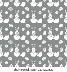Seamless pattern with Easter Bunny looking out of an egg and decorated eggs. Happy Easter. Festive background. Design for banner, poster or print.