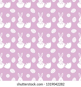 Seamless pattern with Easter Bunny looking out of an egg and decorated eggs. Happy Easter. Festive background. Design for banner, poster or print.