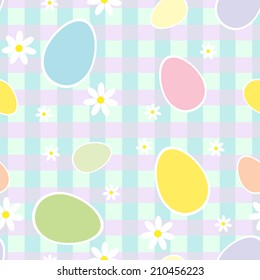 Seamless pattern with Easter colored eggs and flowers