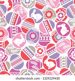Seamless pattern with Easter eggs, flowers, leafs and rabbits over white background. Pink Easter repeatable holidays design. Can be used for fabric, wallpaper, web page,  scrap booking, vector