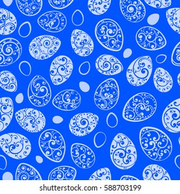 Seamless pattern of Easter eggs with ornaments of curls, white on blue background