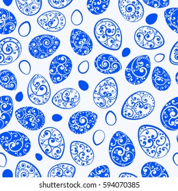 Seamless pattern of Easter eggs with ornaments of curls, blue on white background