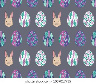 Seamless pattern with easter rabbit and bunny and eggs in purple color. Pattern for holiday easter wallpaper or textile, gift wrapping