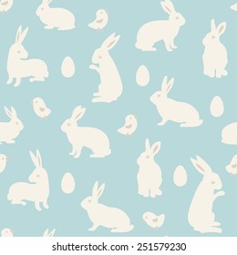 Seamless pattern with eggs, chickens and cute white rabbits. Vector illustration. 