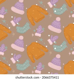 Seamless pattern with elements of warm winter clothes.