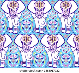 Seamless pattern with elephant and abstract flowers on blue background.