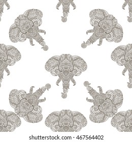Seamless pattern of elephant head with tribal ornaments . Traditional ethnic background, tattoo, African, Indian, Thai, boho design. For print, posters, t-shirts, textiles, coloring book.