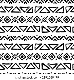 Seamless pattern with ethnic aztec ornament of hand drawn elements. Tribal stylized black and white geometrical print template with shabby texture.
