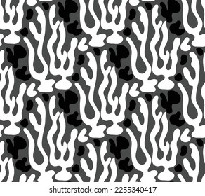 Seamless pattern of ethnic and childish  illustration of abstract blossoming bushes in black and white colors and gray. Can be used as a design for a wrapping paper or textile