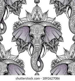 Seamless pattern with ethnic elephant head with mehendi decoration and mandala on white background. Spiritual Ganesha with tribal decoration. Vector texture for fabrics, wallpapers and your creativity
