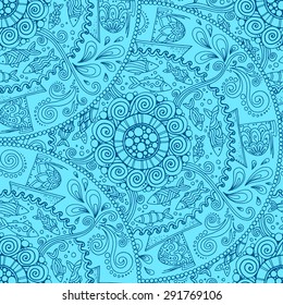 Seamless pattern. Ethnic mandala with decorative ornament, doodle fishes, wind and ships.