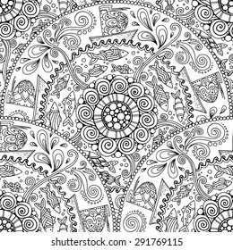 Seamless pattern. Ethnic mandala with decorative ornament, doodle fishes, wind and ships.