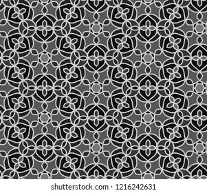 Seamless pattern with ethnic ornament in grey colors.
A monochrome hand drawn seamless vector pattern with flowers, berries and leafs.