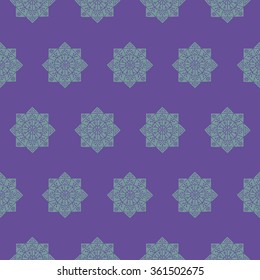 Seamless pattern with ethnic rosettes on a violet background. Vector illustration