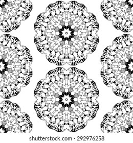 Seamless pattern in ethnic style. Black and white geometric symmetry hand drawn ornament. Boho, oriental, vintage style. Vector pattern