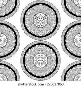 Seamless pattern in ethnic style. Black and white geometric symmetry hand drawn ornament. Boho, oriental, vintage style. Vector pattern
