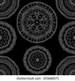 Seamless pattern in ethnic style. Black and white geometric symmetry hand drawn ornament. Boho, oriental, vintage style