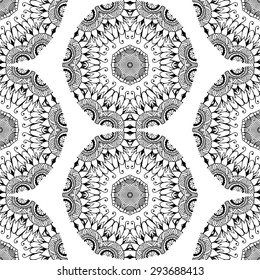 Seamless pattern in ethnic style. Black and white geometric symmetry hand drawn ornament. Boho, oriental, vintage style