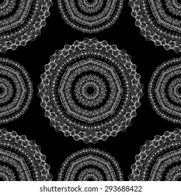 Seamless pattern in ethnic style. Black and white geometric symmetry hand drawn ornament. Boho, oriental, vintage style
